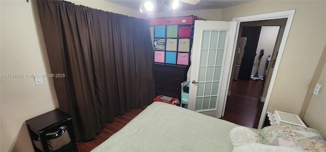 bedroom featuring dark hardwood / wood-style floors and ceiling fan