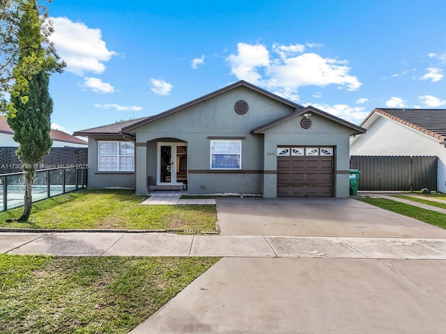 single story home with a garage and a front lawn