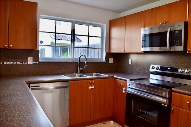 kitchen featuring sink, decorative backsplash, and appliances with stainless steel finishes