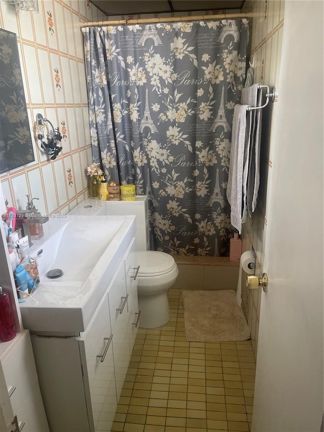 bathroom with vanity, tile patterned flooring, toilet, and a shower with shower curtain