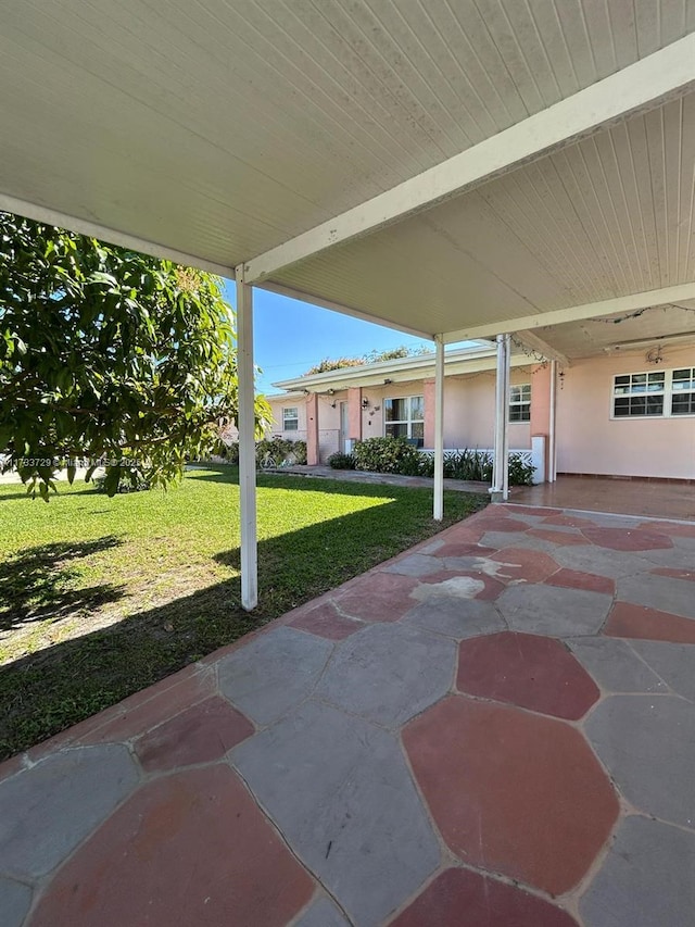 view of patio featuring a carport