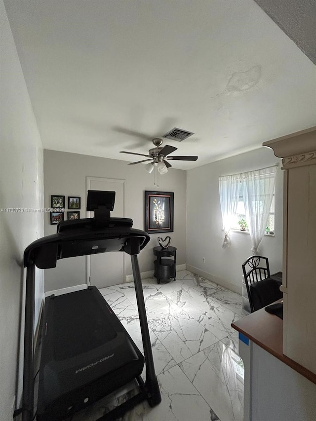 workout room featuring ceiling fan