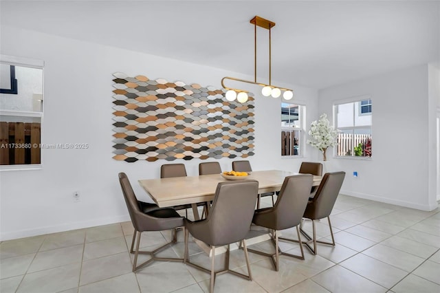 dining area featuring light tile patterned floors