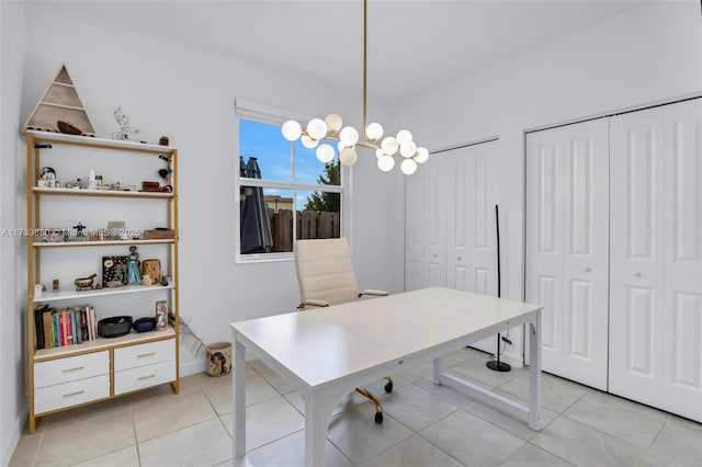 office space with light tile patterned flooring and an inviting chandelier