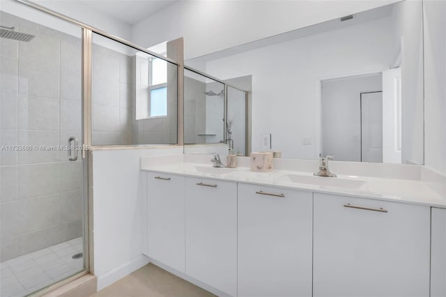 bathroom featuring vanity and an enclosed shower