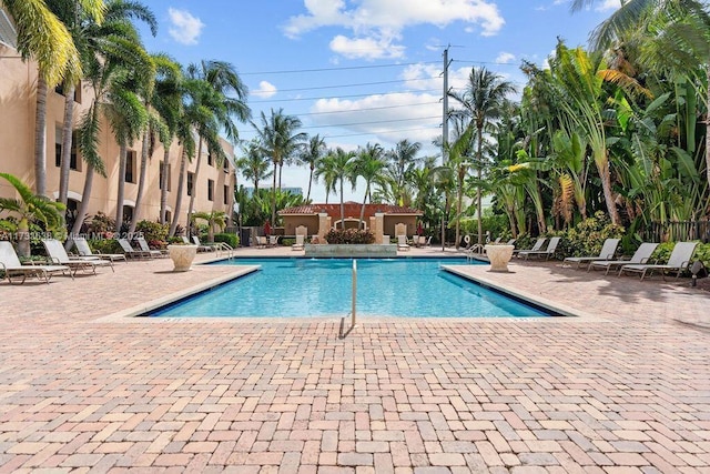 view of swimming pool with a patio