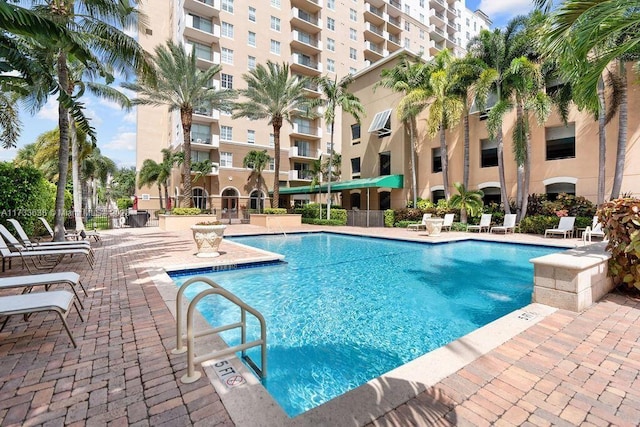 view of swimming pool with a patio area