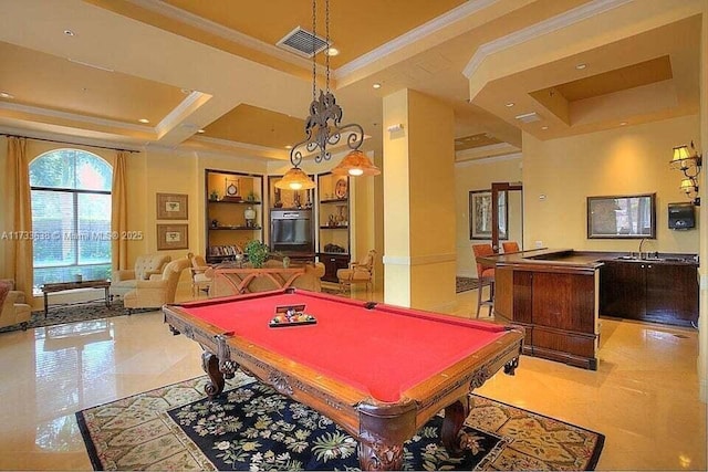 playroom with a raised ceiling, light tile patterned flooring, ornamental molding, and built in shelves