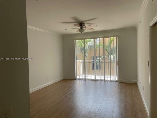 spare room featuring ornamental molding, wood-type flooring, and ceiling fan