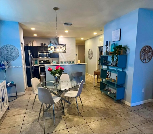 dining space featuring light tile patterned floors