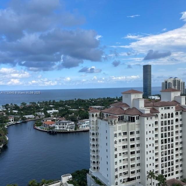 birds eye view of property featuring a water view