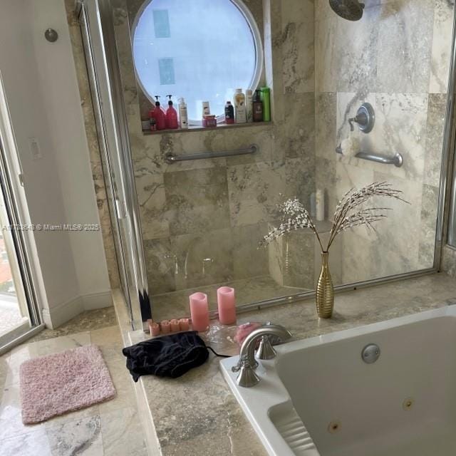 bathroom with separate shower and tub