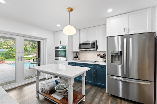 kitchen with blue cabinets, pendant lighting, white cabinetry, and appliances with stainless steel finishes