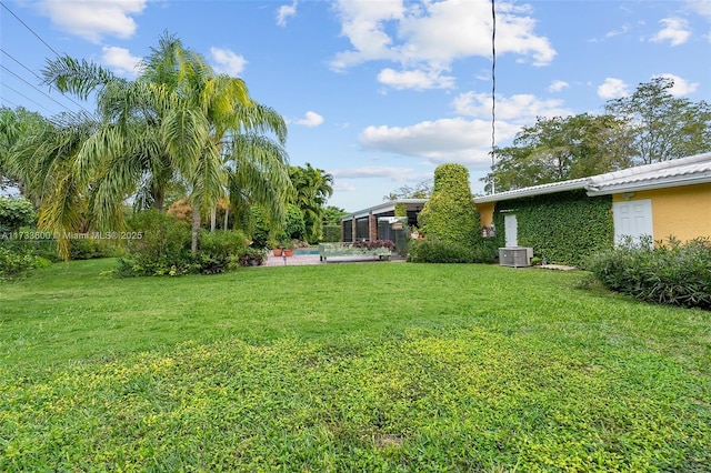 view of yard with central AC