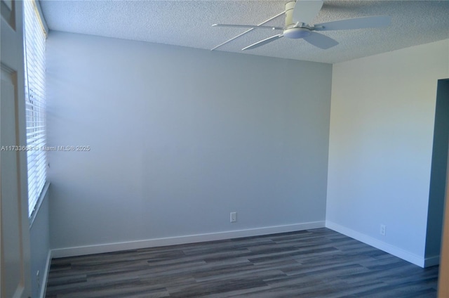 unfurnished room featuring ceiling fan, plenty of natural light, dark hardwood / wood-style floors, and a textured ceiling