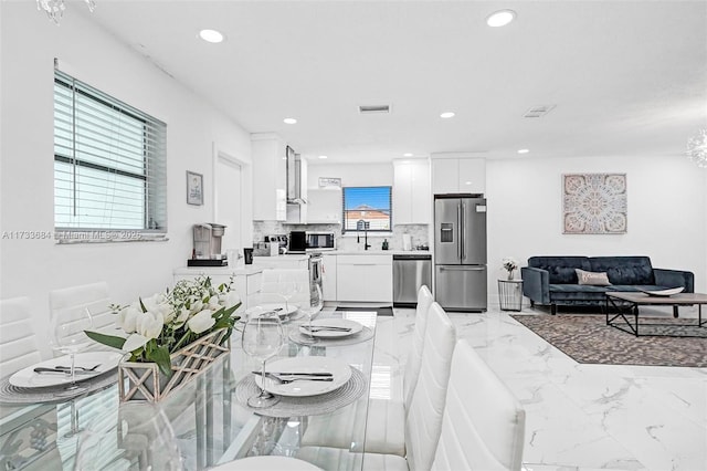 dining area with plenty of natural light