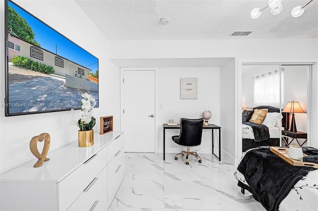 office area with a textured ceiling