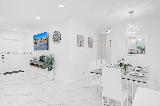 dining area with a notable chandelier