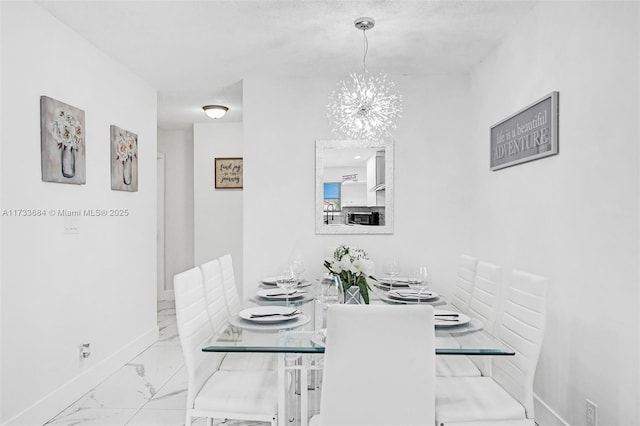 dining area featuring an inviting chandelier