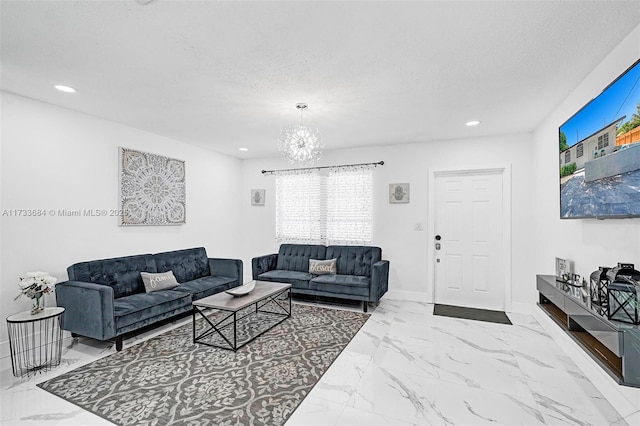 living room with a chandelier and a textured ceiling