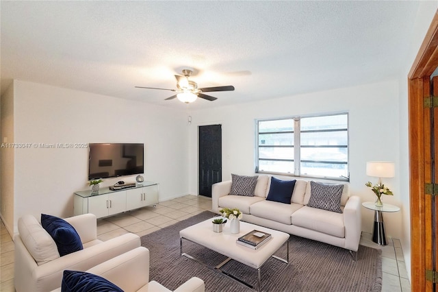 tiled living room with ceiling fan