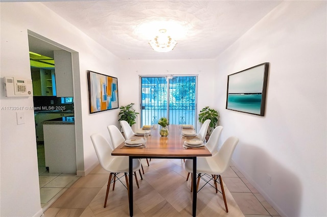 dining space with a chandelier