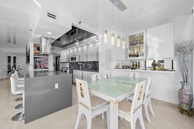19667 Turnberry Way Unit 20B, Aventura, FL 33180 - dining area with light tile patterned floors