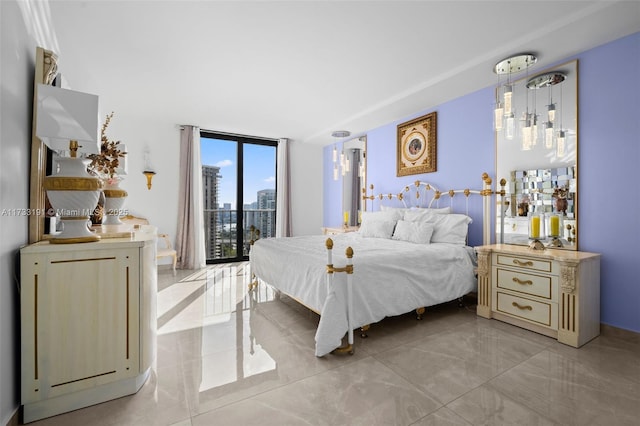 bedroom featuring floor to ceiling windows