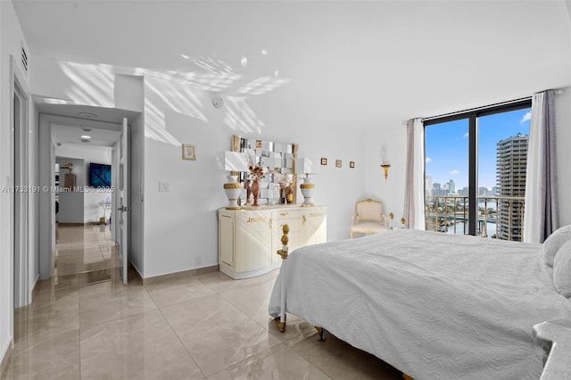 19667 Turnberry Way Unit 20B, Aventura, FL 33180 - bedroom with a skyline view, baseboards, and light marble finish flooring