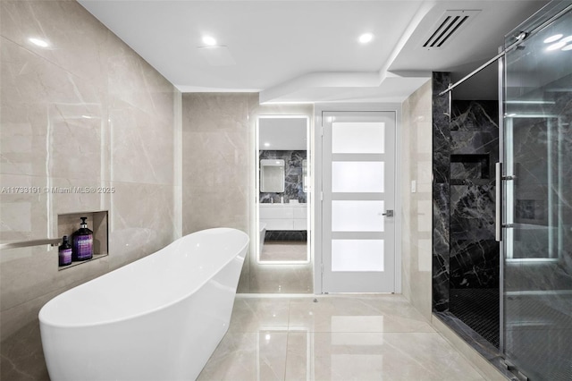 19667 Turnberry Way Unit 20B, Aventura, FL 33180 - full bathroom with a stall shower, a soaking tub, tile walls, and marble tiled floors