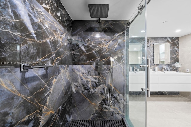 bathroom featuring vanity and an enclosed shower