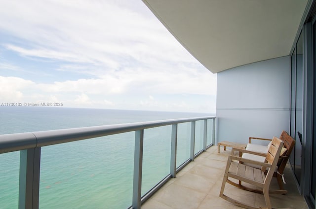 balcony featuring a water view