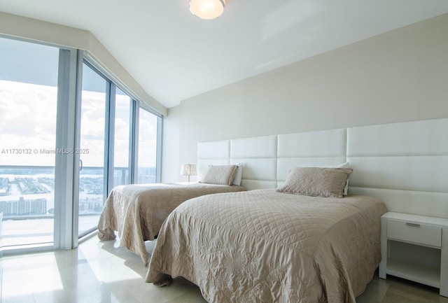 bedroom featuring access to outside and vaulted ceiling