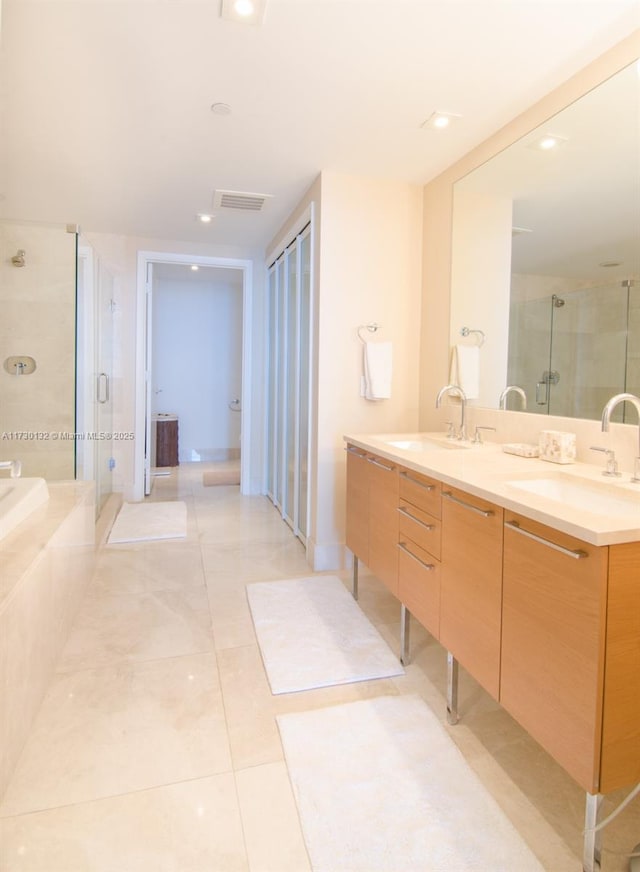 bathroom featuring vanity, separate shower and tub, and tile patterned flooring