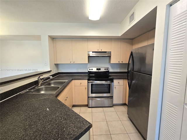 kitchen with light brown cabinetry, sink, black fridge, stainless steel electric range, and light tile patterned floors