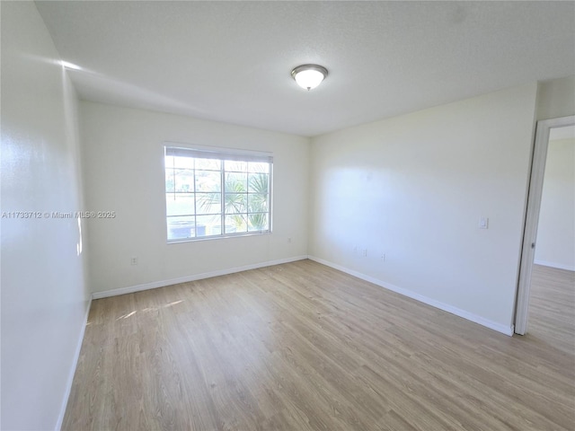 unfurnished room featuring light wood-type flooring