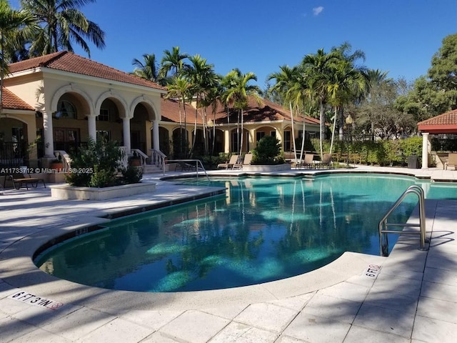 view of swimming pool with a patio area