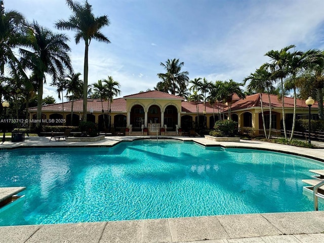 view of swimming pool featuring a patio area