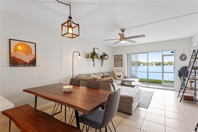 kitchen featuring light tile patterned flooring, appliances with stainless steel finishes, sink, and white cabinets