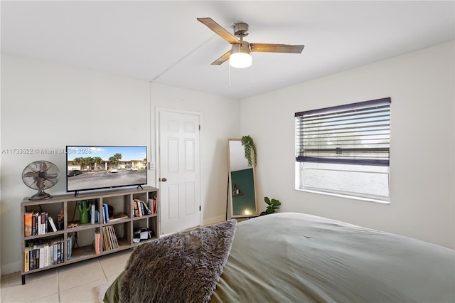 tiled bedroom with ceiling fan