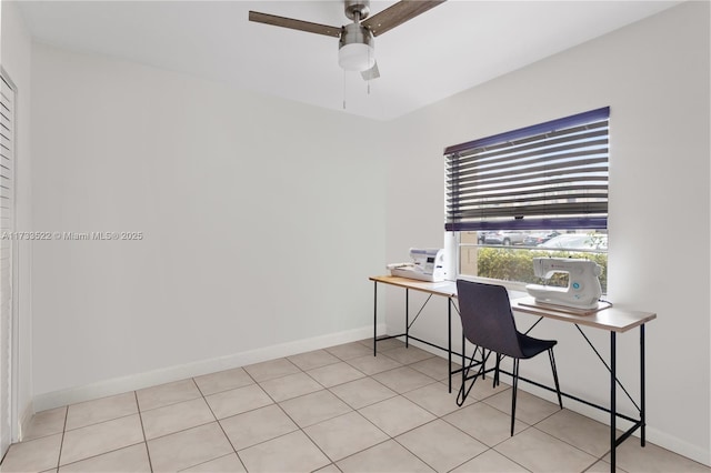 office area with baseboards and a ceiling fan