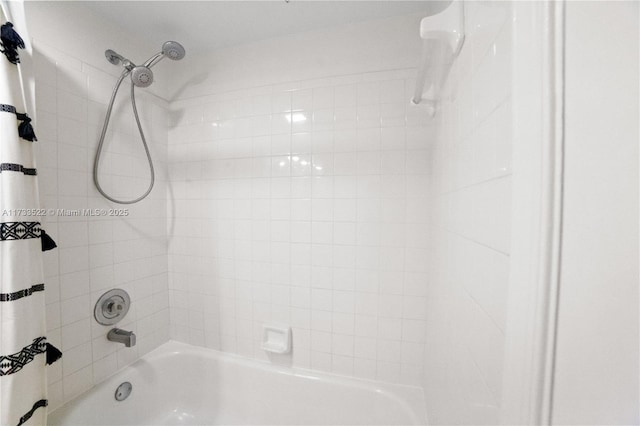 bathroom with shower / tub combo with curtain