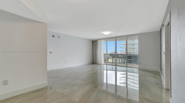 empty room featuring expansive windows