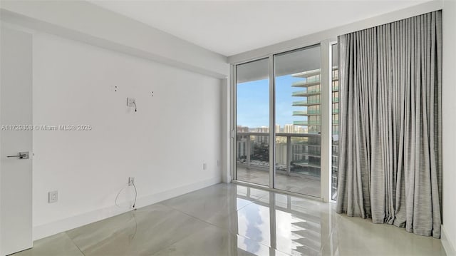 empty room with floor to ceiling windows