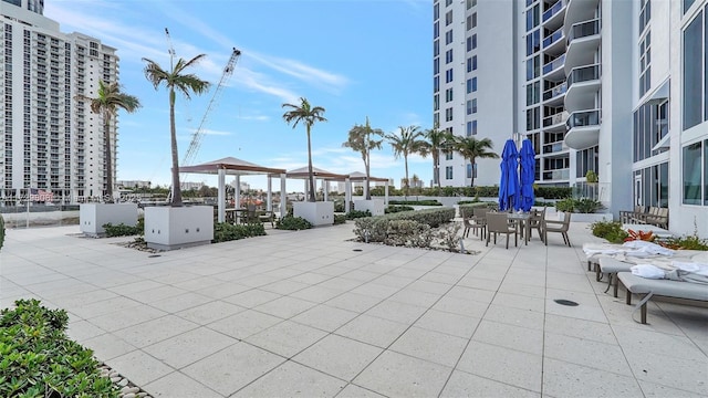 view of property's community with a gazebo and a patio