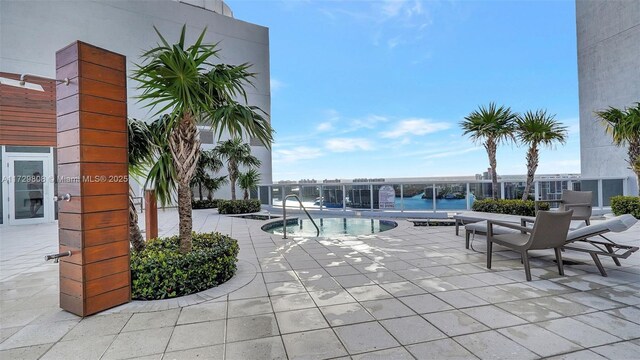 view of swimming pool with a patio