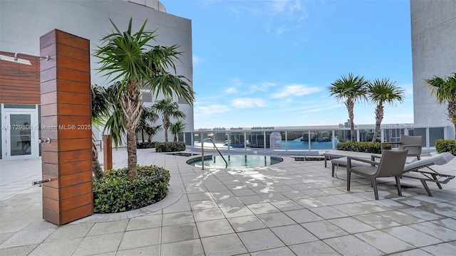 view of swimming pool with a patio