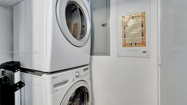 washroom with stacked washer and clothes dryer