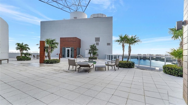 view of patio featuring a water view