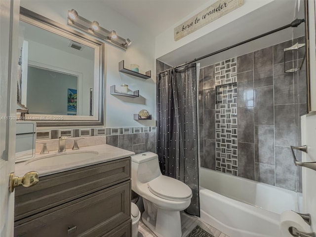 full bathroom featuring tile walls, shower / tub combo, vanity, and toilet